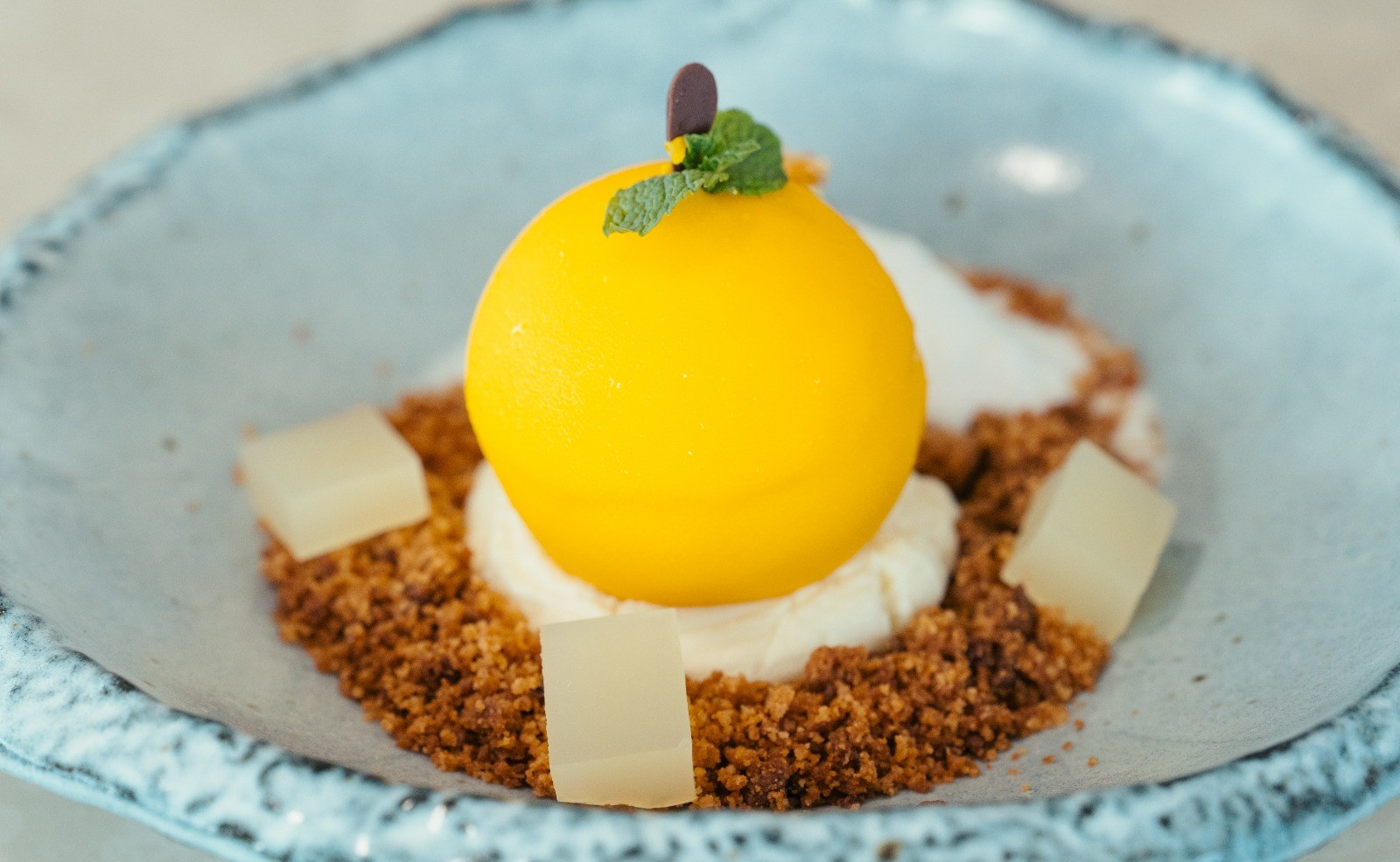 Yuzu Sphere — yuzu mousse, white chocolate crémeux, citrus gel & almond crumble
