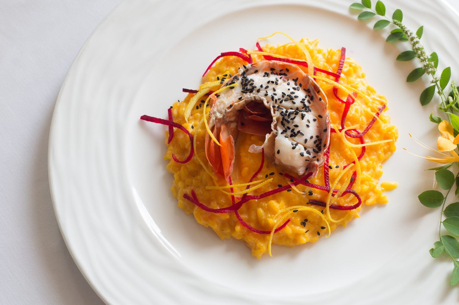 Risotto allo Zafferano, Aragosta Poche, Zeste di Agrumi e Bietola rossa