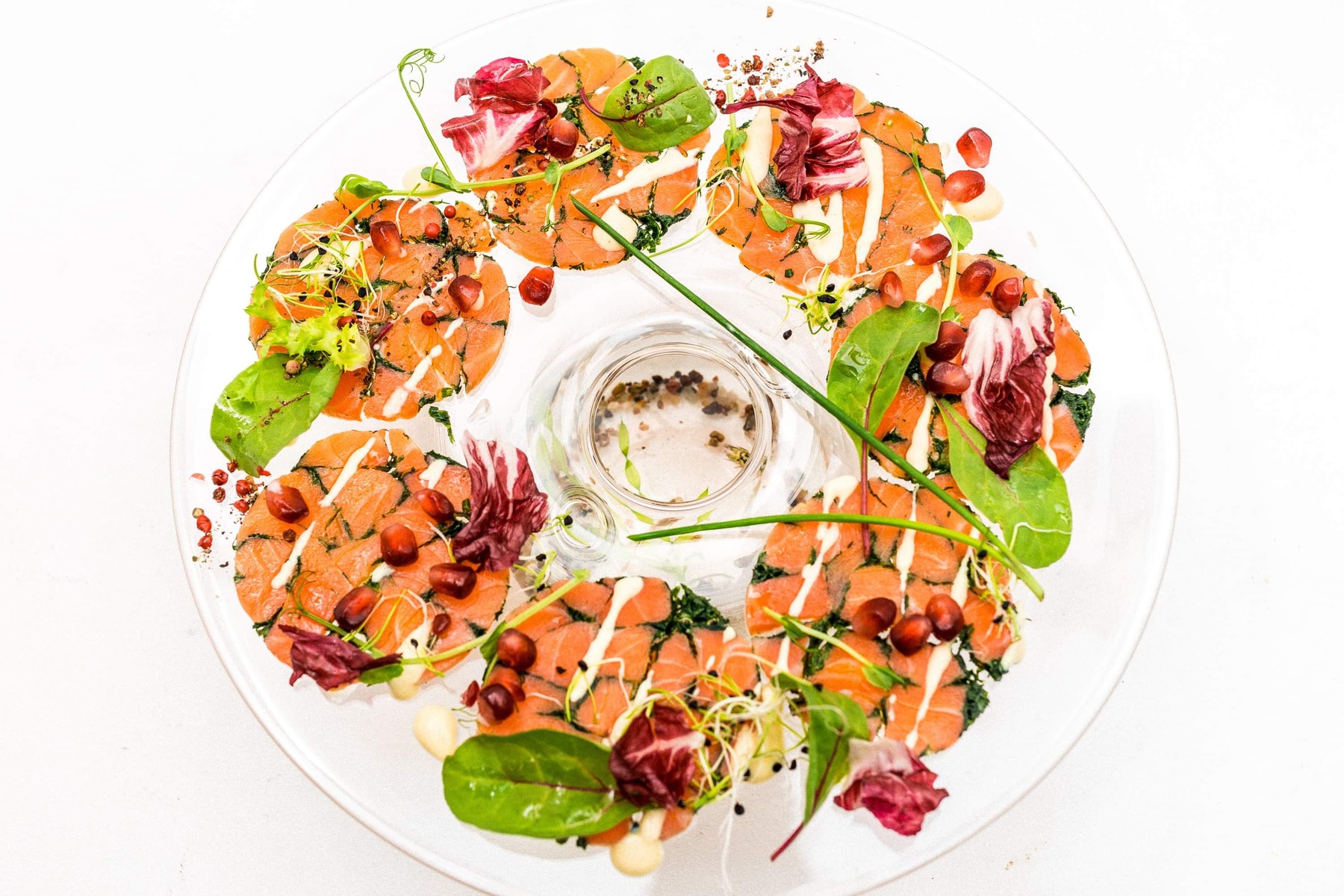 Salmon Mosaic — house-cured Atlantic salmon, pomegranate, baby leaves, citrus aioli and herb oil