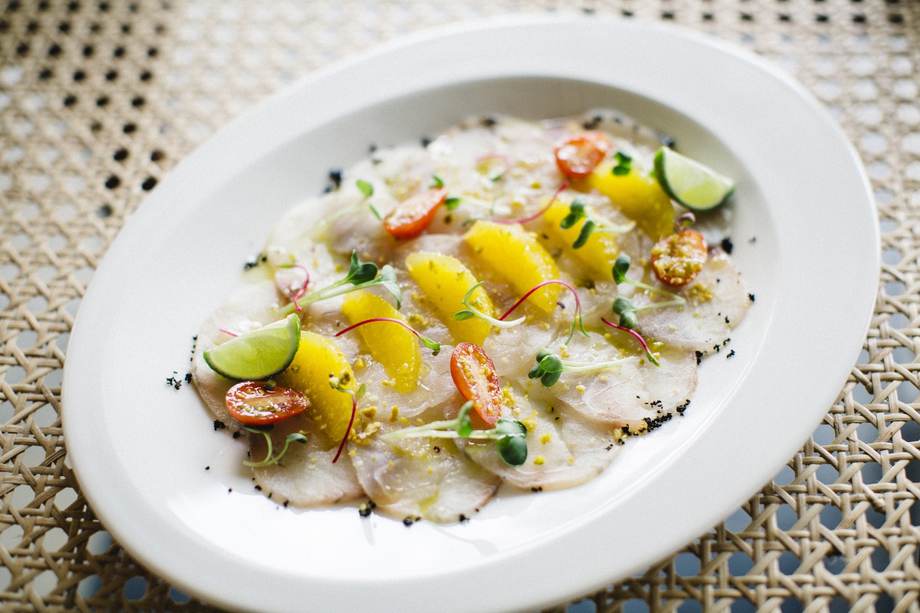 Mediterranean Sea Bass Crudo — citrus, finger lime, virgin oil, dried black olives